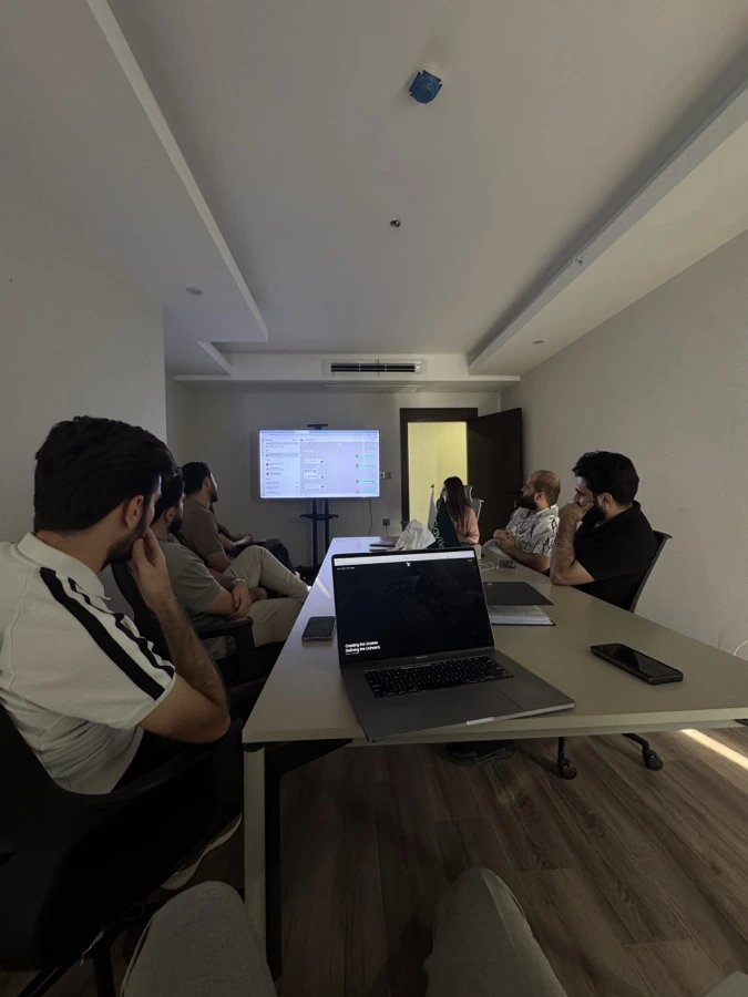 The Shafeay Group team in a meeting room around a shared screen